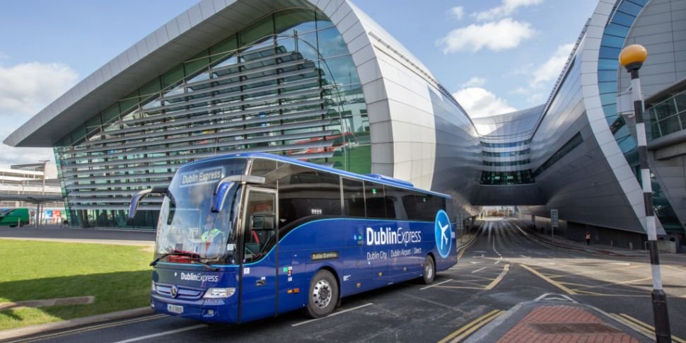 Dublin-Express-Coach-driving-at-Dublin-Airport-with-Terminal-2-in-background